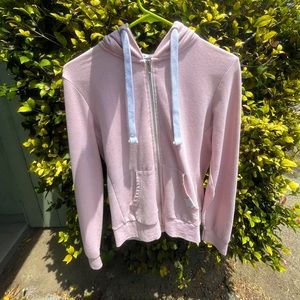 A reflex light pink jacket in a size large